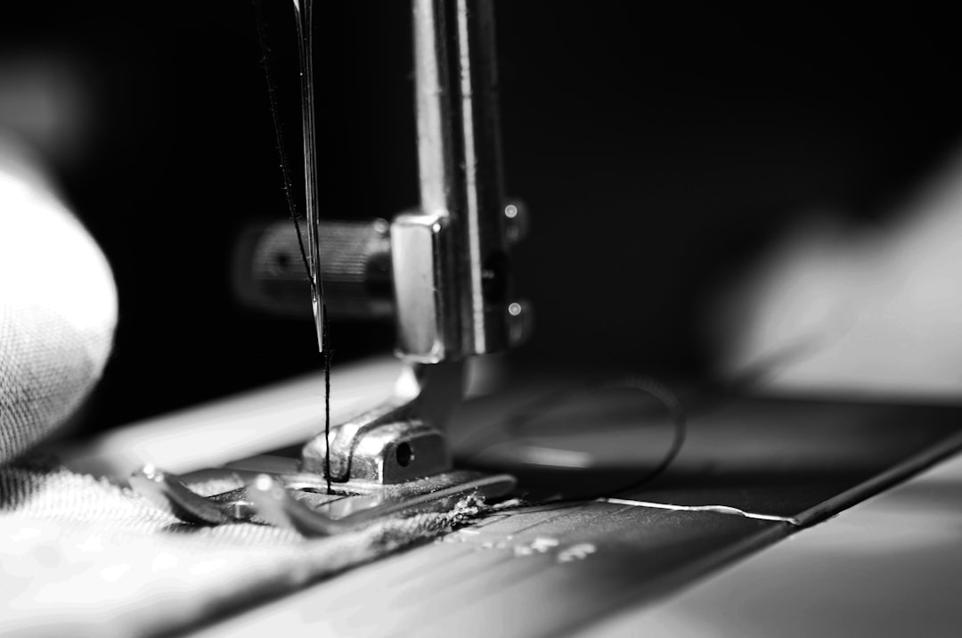 about-01 Black and white image of a sewing machine needle